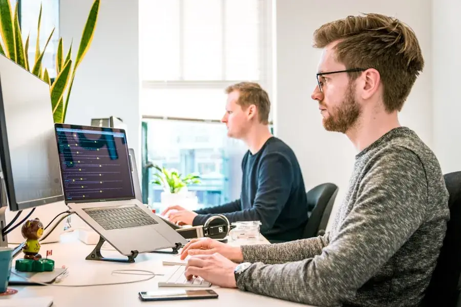 Software engineers working together at Papaya Coders